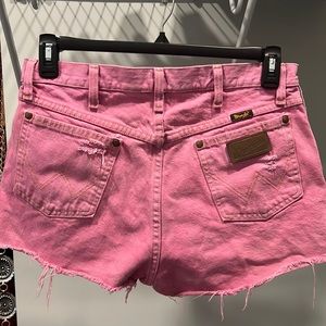 Faded pink cut off high waisted wranglers